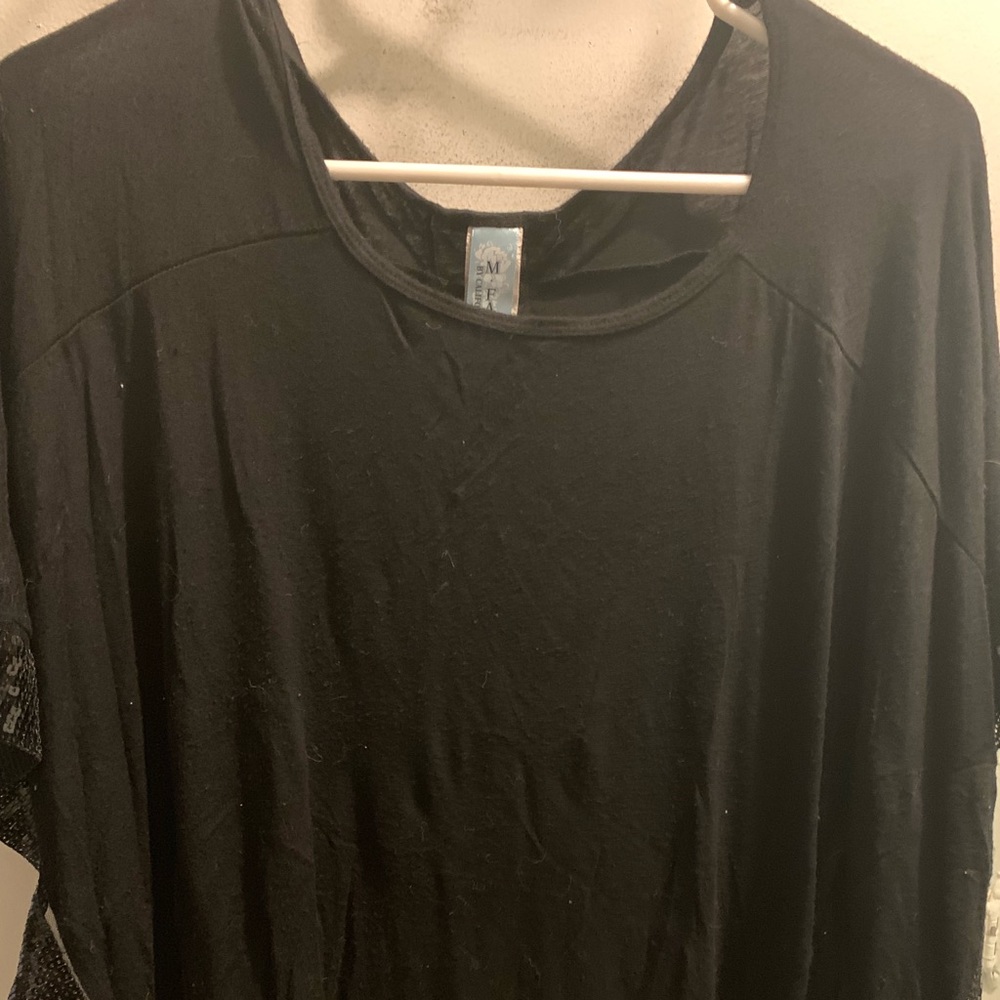 Black blouse with sequenced edging